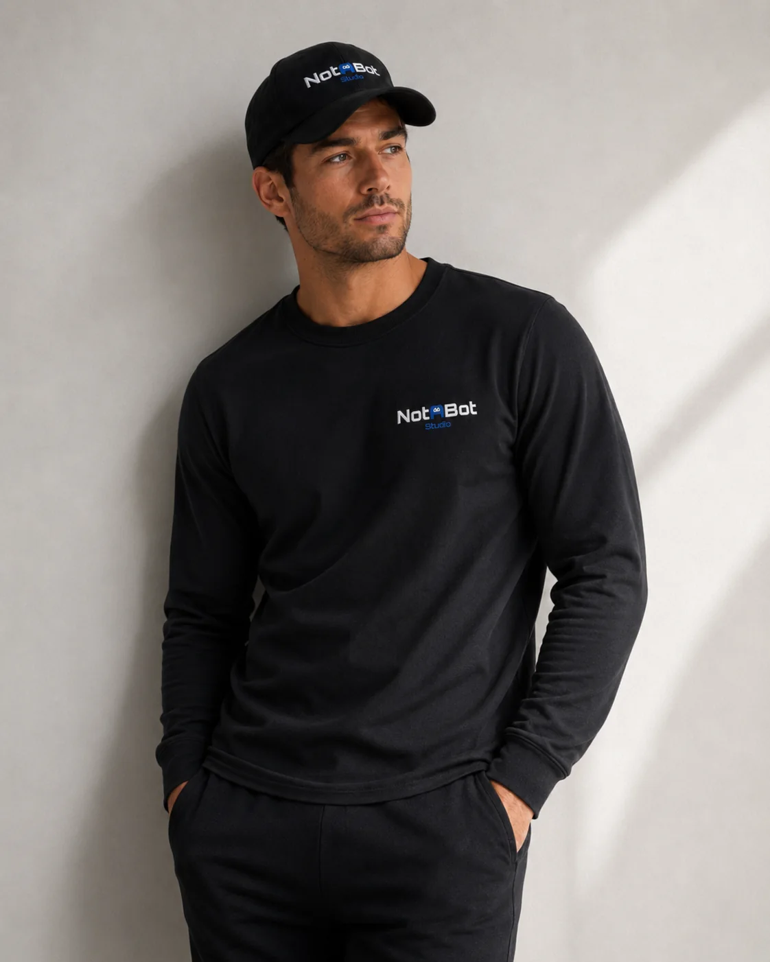 Black Notabot Studio long sleeve top and cap
